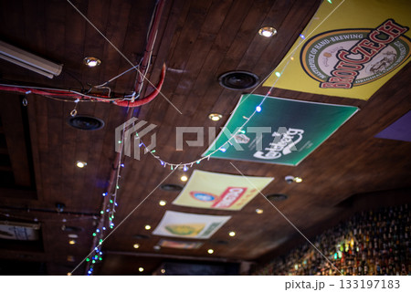 Ceiling of a bar with beer brand signs and string lights in Seoul, South Korea 133197183