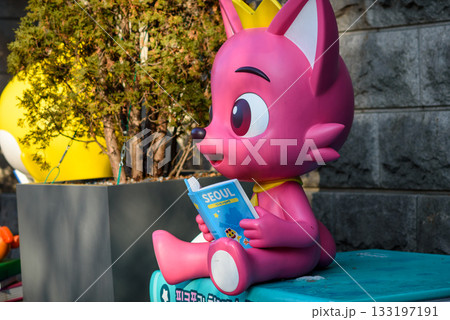 Pink cartoon fox statue promoting reading and education, in Seoul, South Korea 133197191