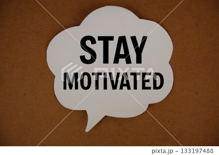 Stay Motivated text with speech bubble top view on yellow background 133197488