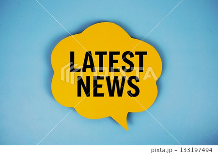 Latest News text with speech bubble top view on blue background Latest News text with speech bubble top view on blue background 133197494