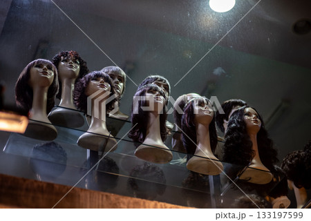 Display of mannequin heads with various wigs in a shop window in Seoul, South Korea Display of mannequin heads with various wigs in a shop window in Seoul, South Korea 133197599