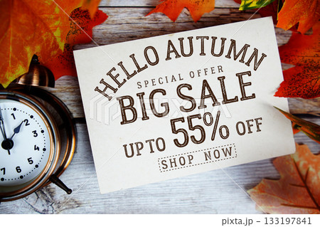 Hello Autumn Big Sale 55% off Special Offer with maple leaf decoration on wooden background Hello Autumn Big Sale 55% off Special Offer with maple leaf decoration on wooden background 133197841