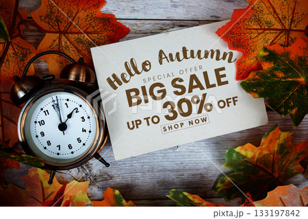 Hello Autumn Big Sale 30% off Special Offer with maple leaf decoration on wooden background Hello Autumn Big Sale 30% off Special Offer with maple leaf decoration on wooden background 133197842