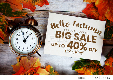 Hello Autumn Big Sale 40% off Special Offer with maple leaf decoration on wooden background Hello Autumn Big Sale 40% off Special Offer with maple leaf decoration on wooden background 133197843