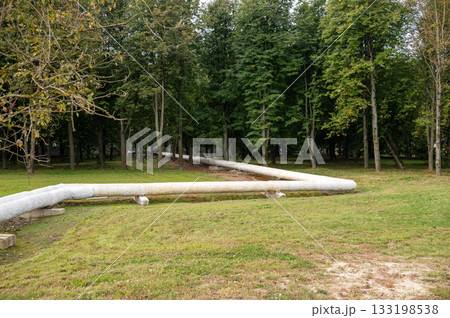 Scenery of above-ground pipeline in green forested park Scenery of above-ground pipeline in green forested park 133198538