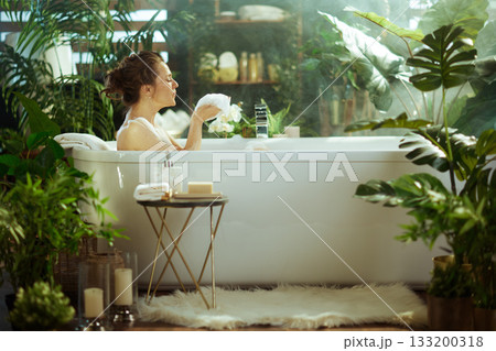 Profile of Woman Enjoying a Luxurious Bubble Bath Profile of Woman Enjoying a Luxurious Bubble Bath 133200318
