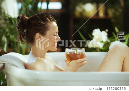 Peaceful Bath with Warm Beverage and Greenery 133200336