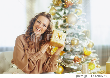 Cheerful Woman with Polka Dot Christmas Gift 133200739