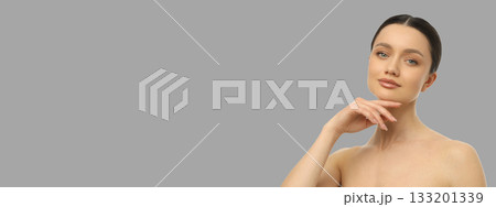 Model showcases confidence and elegance while posing in a studio Model showcases confidence and elegance while posing in a studio 133201339