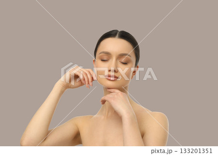 Model strikes an elegant pose, showcasing calm features 133201351