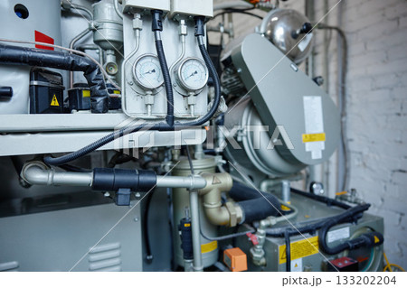 A detailed close up of a machine featuring two gauges situated on it A detailed close up of a machine featuring two gauges situated on it 133202204