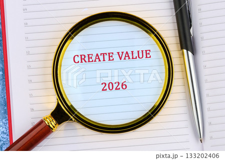 A close-up showing an agenda with the words CREATE VALUE and 2026 emphasized under a magnifying glass, with a pen resting nearby, symbolizing future planning A close-up showing an agenda with the words CREATE VALUE and 2026 emphasized under a magnifying glass, with a pen resting nearby, symbolizing future planning 133202406