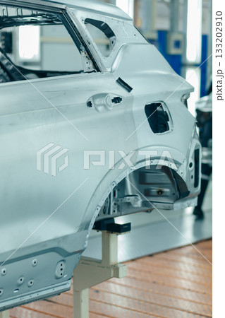 View on rear part of Car frame structure on automobile manufacturing line. Hole for a gas gun. View on rear part of Car frame structure on automobile manufacturing line. Hole for a gas gun. 133202910