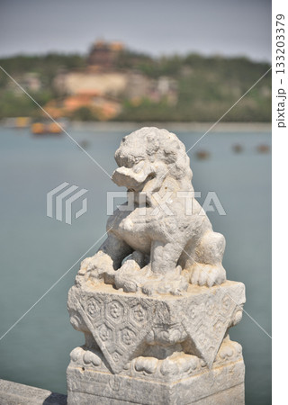 Dragon statue on the Seventeen-Arch Bridge in The Summer Palace, complex of gardens and palaces in Beijing, China 133203379