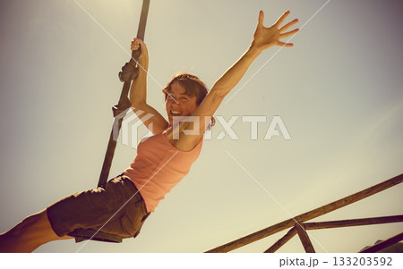 Adult woman having fun on zipline 133203592