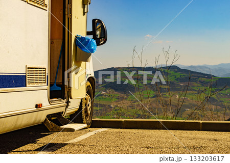 Camper door with trash can. 133203617