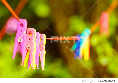 Clothes pegs on line outdoor. Housework Clothes pegs on line outdoor. Housework 133203624