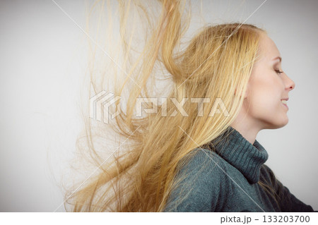 Girl with blowing long hair Girl with blowing long hair 133203700
