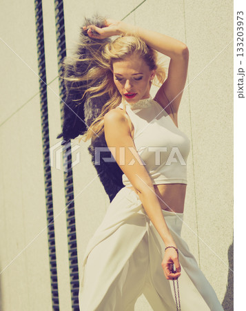 Woman wearing crop top and culottes 133203973