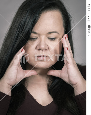 Worried woman having painfull headache Worried woman having painfull headache 133204413