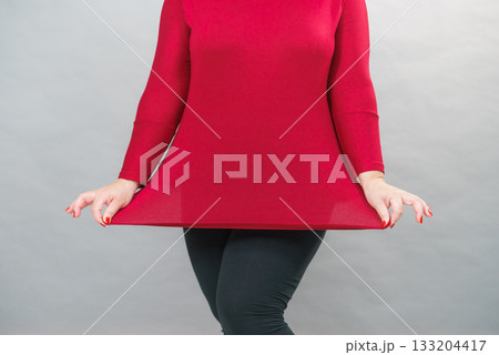 Woman plus size in red tunic 133204417