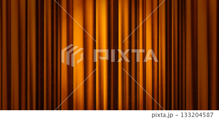 Closed orange theater curtains with a spotlight and vignetting serve as a bg for Broadway or circus performances Closed orange theater curtains with a spotlight and vignetting serve as a bg for Broadway or circus performances 133204587
