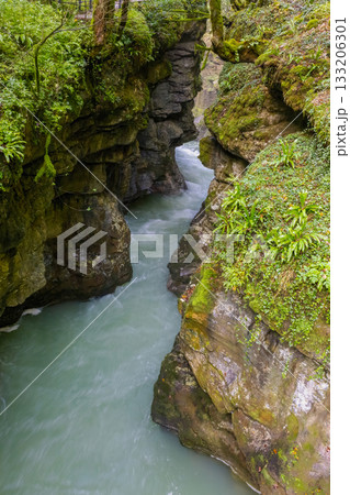 rapid flow of the river in a deep gorge rapid flow of the river in a deep gorge 133206301