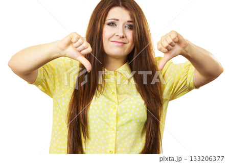 Woman showing thumb down gesture Woman showing thumb down gesture 133206377