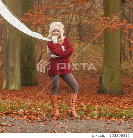 Fashion woman in windy fall autumn park forest. 133206555