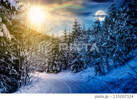 winter mountain landscape. day and night time change concept. curve of country road that leads into the coniferous forest covered with snow with sun and moon at twilight. equality and shift template 133207324