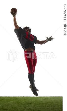 American football player catching ball mid-air with energetic emotion isolated on white background 133207365