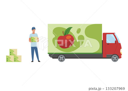 A truck driver loads boxes of apple juice into a truck. A man holds a basket of apples by a red delivery truck 133207969