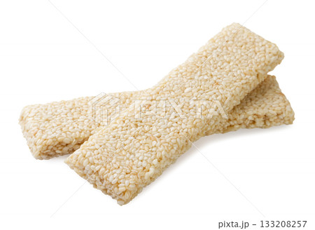 Bars with sesame seeds, kozinaki close up on a white. Isolated 133208257