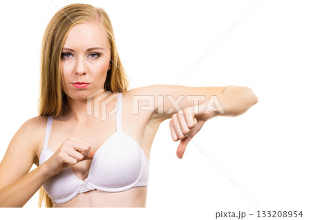 Woman dissatisfied with size of bra breasts 133208954