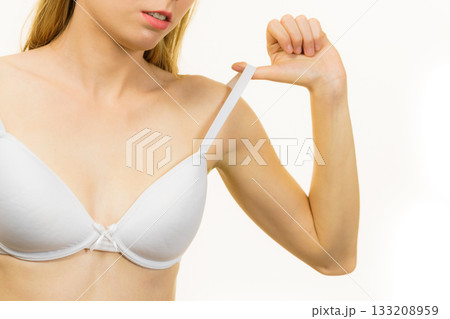Young woman holding bra strap Young woman holding bra strap 133208959