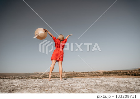 Woman in Red Dress Admiring the View 133209711