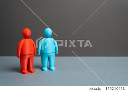 Two people with opposing political views, values, and visions. The differences and dissimilarities of two competing sides. Ideological confrontation and polarization. Political analysis, elections 133210438