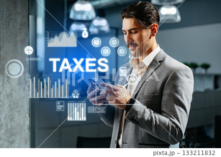 Business professional reviews tax information on smartphone in modern office environment 133211832