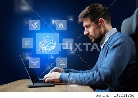 Lawyer using technology to enhance legal practice in a modern office setting Lawyer using technology to enhance legal practice in a modern office setting 133211856