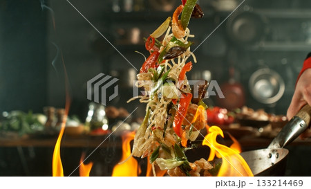 Freeze Motion of Flying Asian Meal with Vegetable and Prawns into Wok Pan Freeze Motion of Flying Asian Meal with Vegetable and Prawns into Wok Pan 133214469