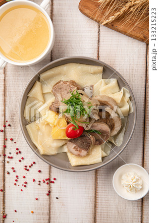 Beshbarmak with broth and meat Beshbarmak with broth and meat 133215223