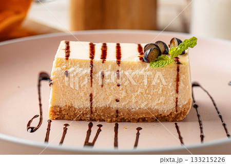 Cheesecake slice with grapes and mint Cheesecake slice with grapes and mint 133215226