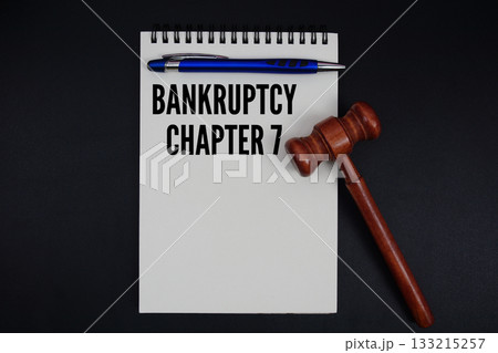 Bankruptcy Chapter 7 text written on notepad with gavel on black background Bankruptcy Chapter 7 text written on notepad with gavel on black background 133215257