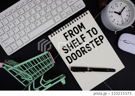 From Shelf To Doorstep text written on notepad with keyboard and trolley shopping cart on black background 133215373