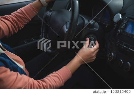 Person In Car Starting Engine With Keys In Hand Inside Vehicle Cabin Person In Car Starting Engine With Keys In Hand Inside Vehicle Cabin 133215406