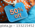 Blue stitched tag with 50 percent off text. Retail discount, sale promotion, online shopping marketing. Black Friday, Cyber Monday, price reduction. E-commerce advertising concept with modern texture. Blue stitched tag with 50 percent off text. Retail discount, sale promotion, online shopping marketing. Black Friday, Cyber Monday, price reduction. E-commerce advertising concept with modern texture. 133215452