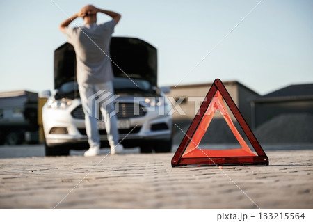 Unfortunate, transport is broken, red sign. Man is with his car outdoors Unfortunate, transport is broken, red sign. Man is with his car outdoors 133215564
