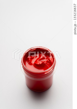 Close-up of colorful paints. Red paint on a white background. Space for drawing 133216637