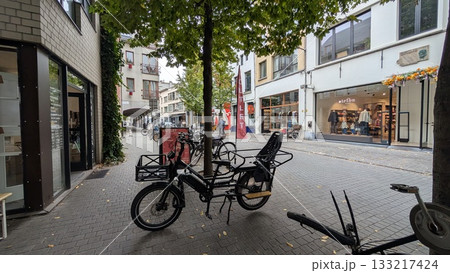 An European bicycle with child's seat parked on the street in Antwerp 133217424