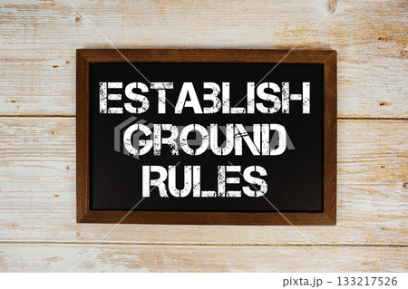 Establish Ground Rules text written on blackboard flat lay on wooden background 133217526